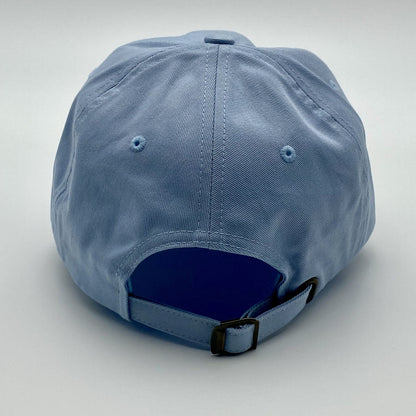 Blue racing cap with adjustable buckle on a light gray background