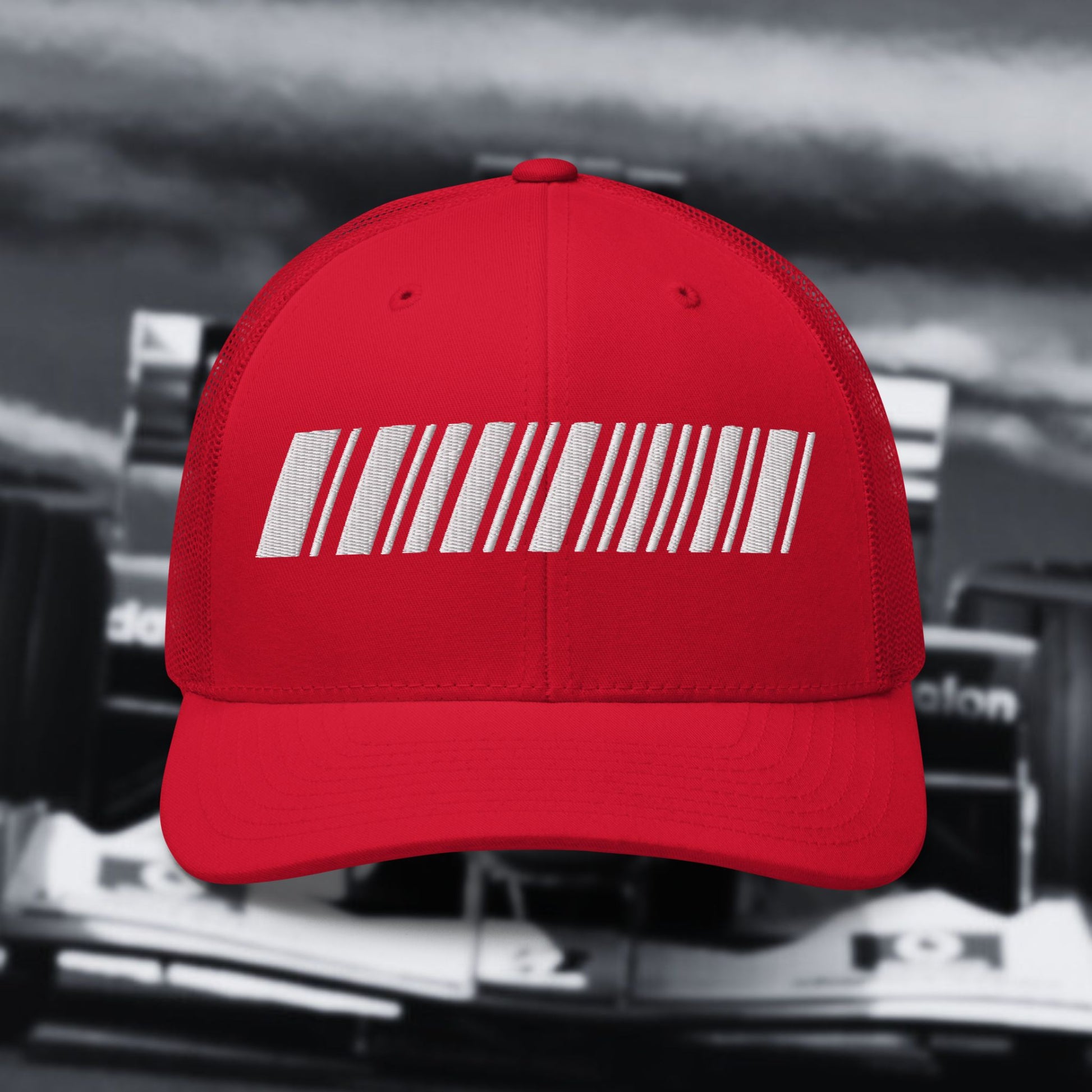 Red cap with a white barcode design on a blurred background