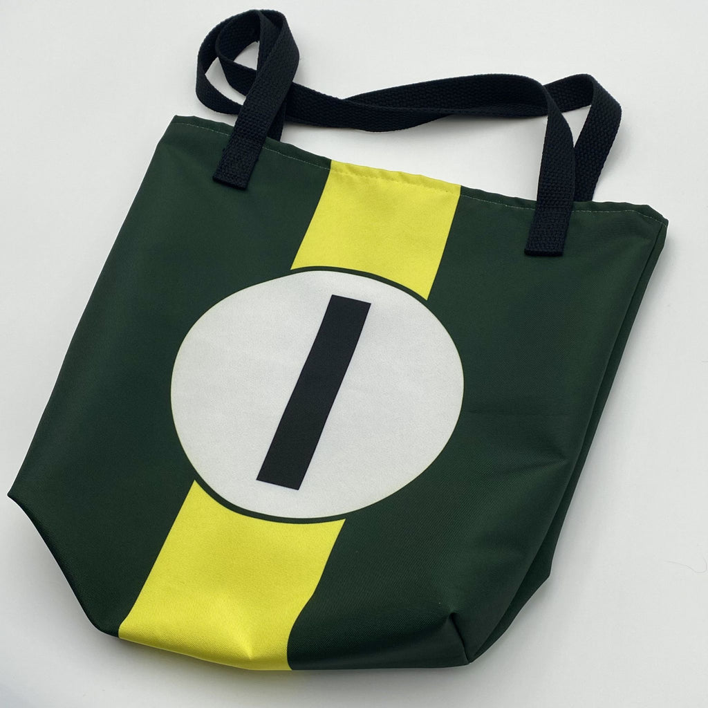 Green and yellow tote bag with a white circle and black number "1" on a light gray background