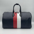 Black duffle bag with red and white stripes on a white background