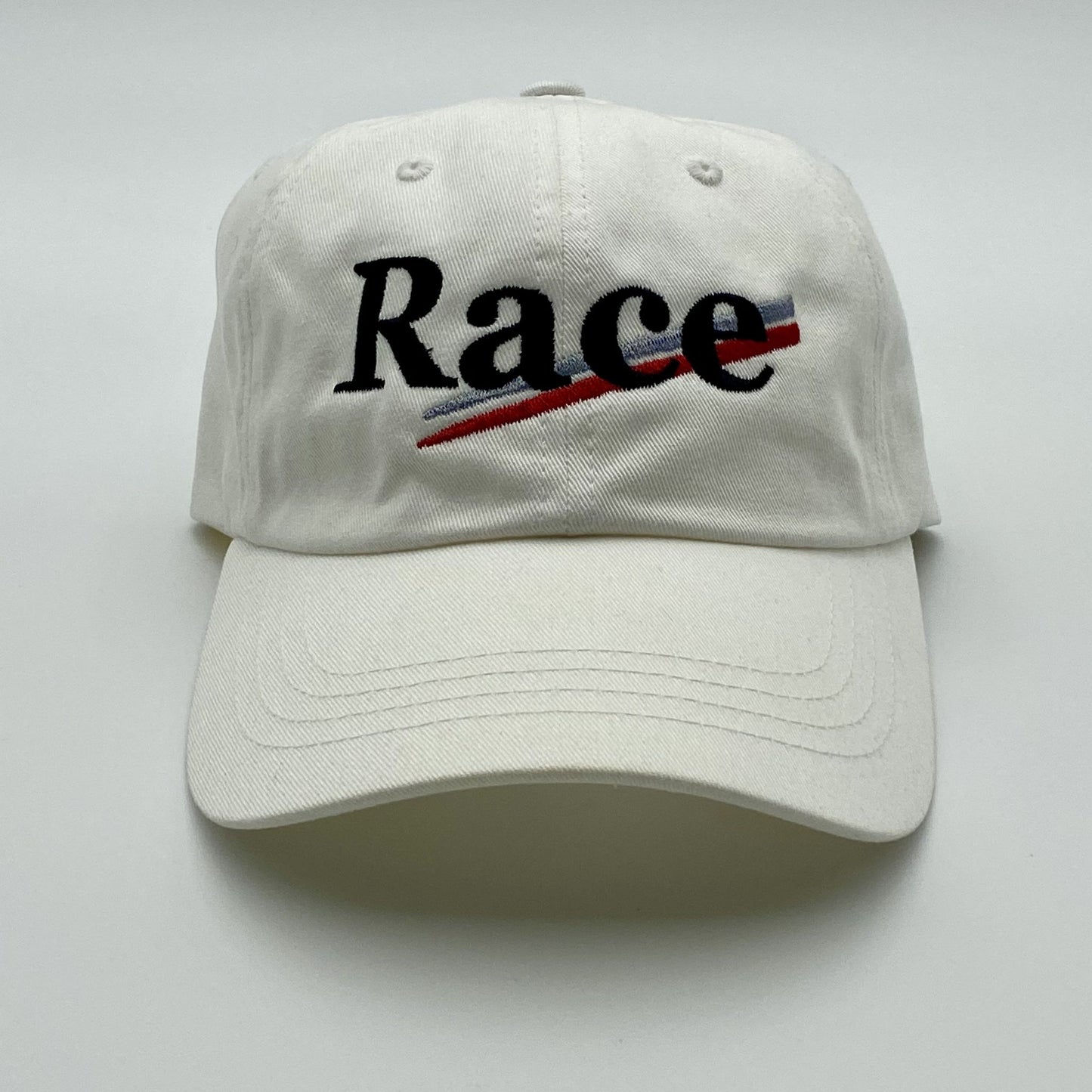 White hat with 'Race' stitched on a white background