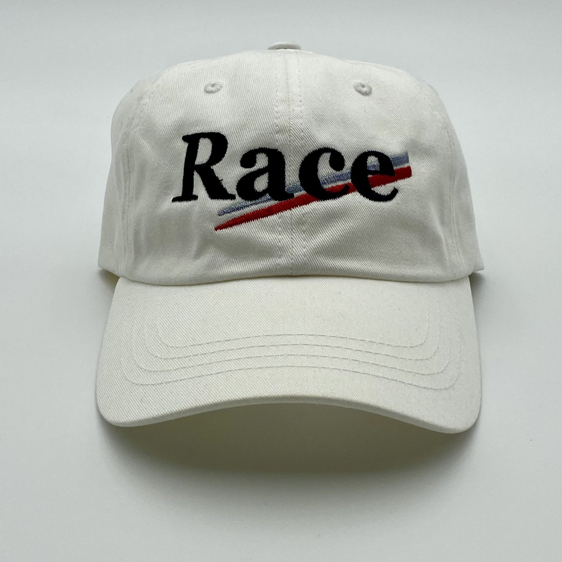 White hat with 'Race' stitched on a white background