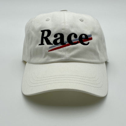 White hat with 'Race' stitched on a white background