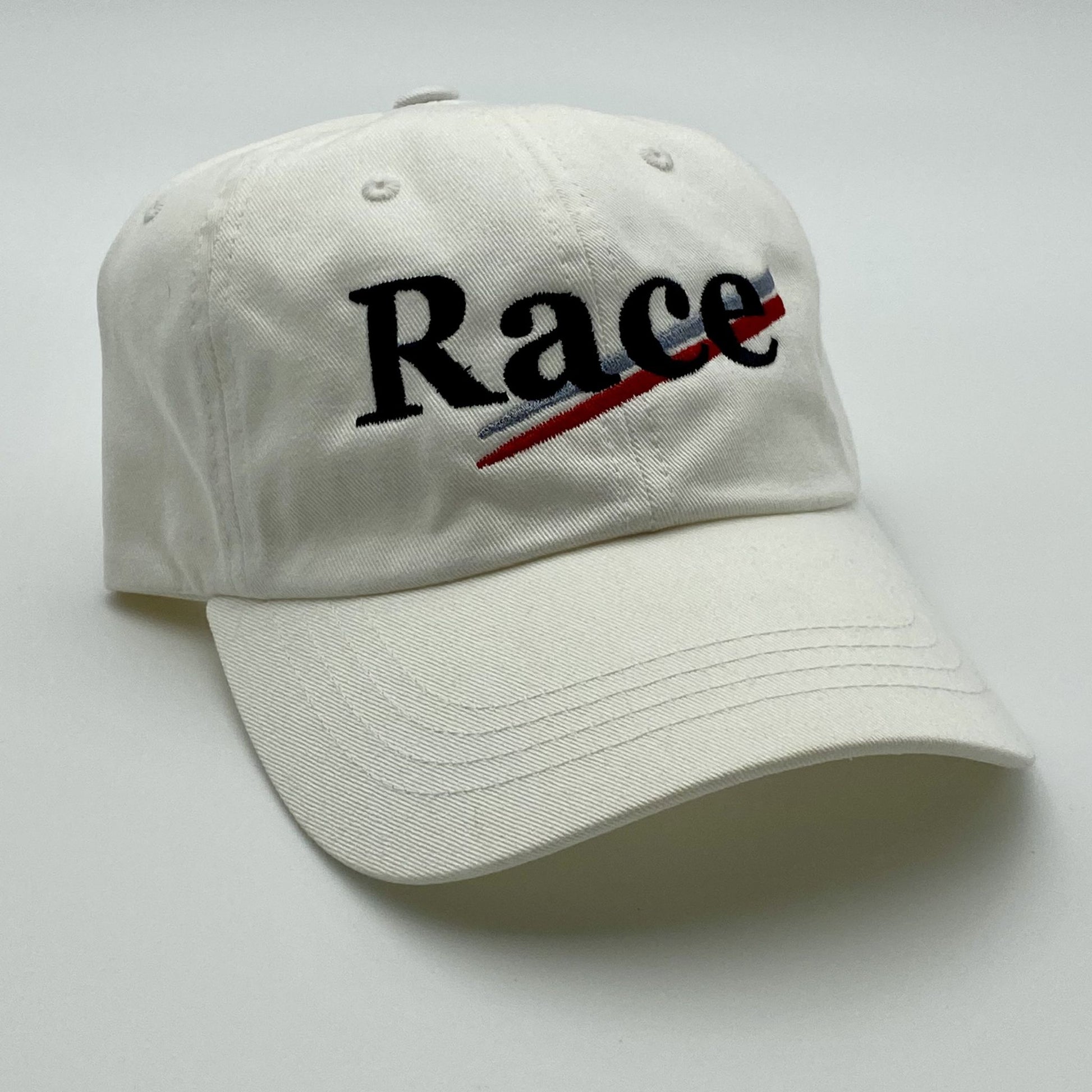 White cap with 'Race' embroidered on a white background