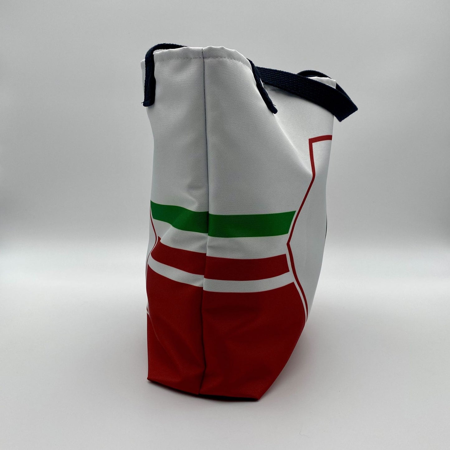 White bag with red and green accents on a gray background