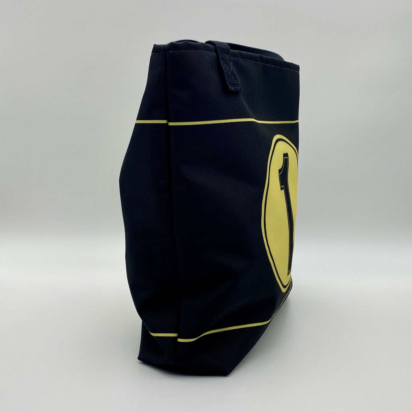 Black bag with yellow stripes on a white background