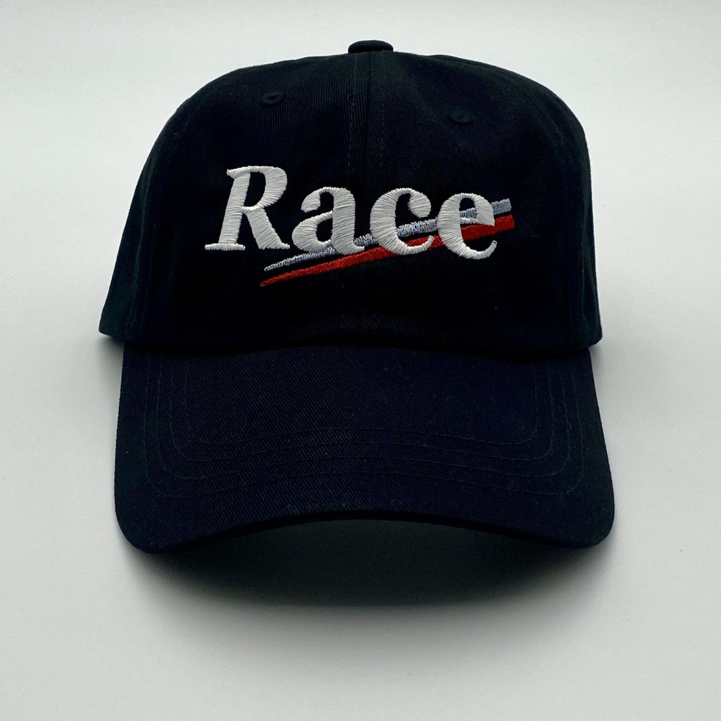 Black cap with 'Race' embroidered on a white background