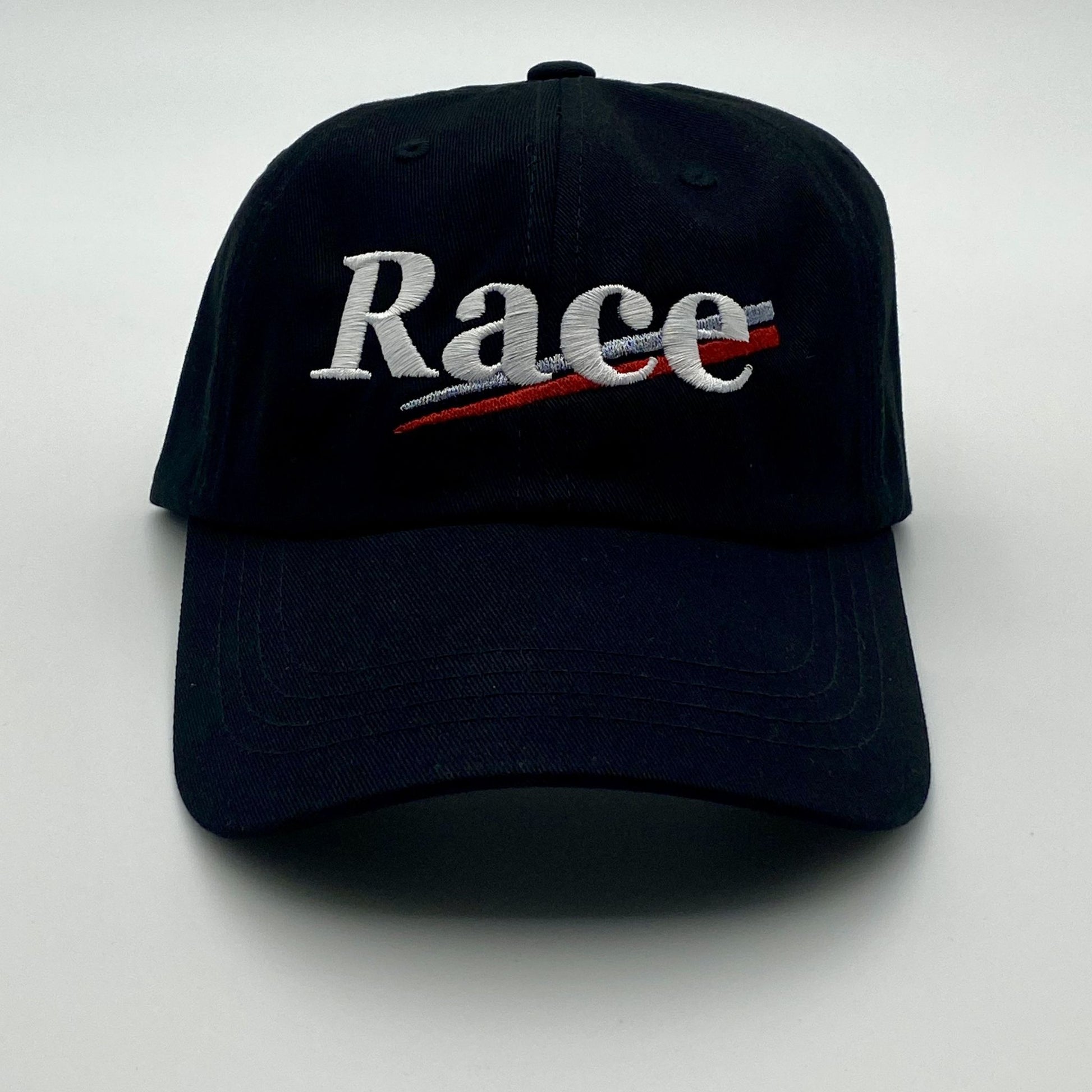 Black cap with 'Race' embroidered on a white background