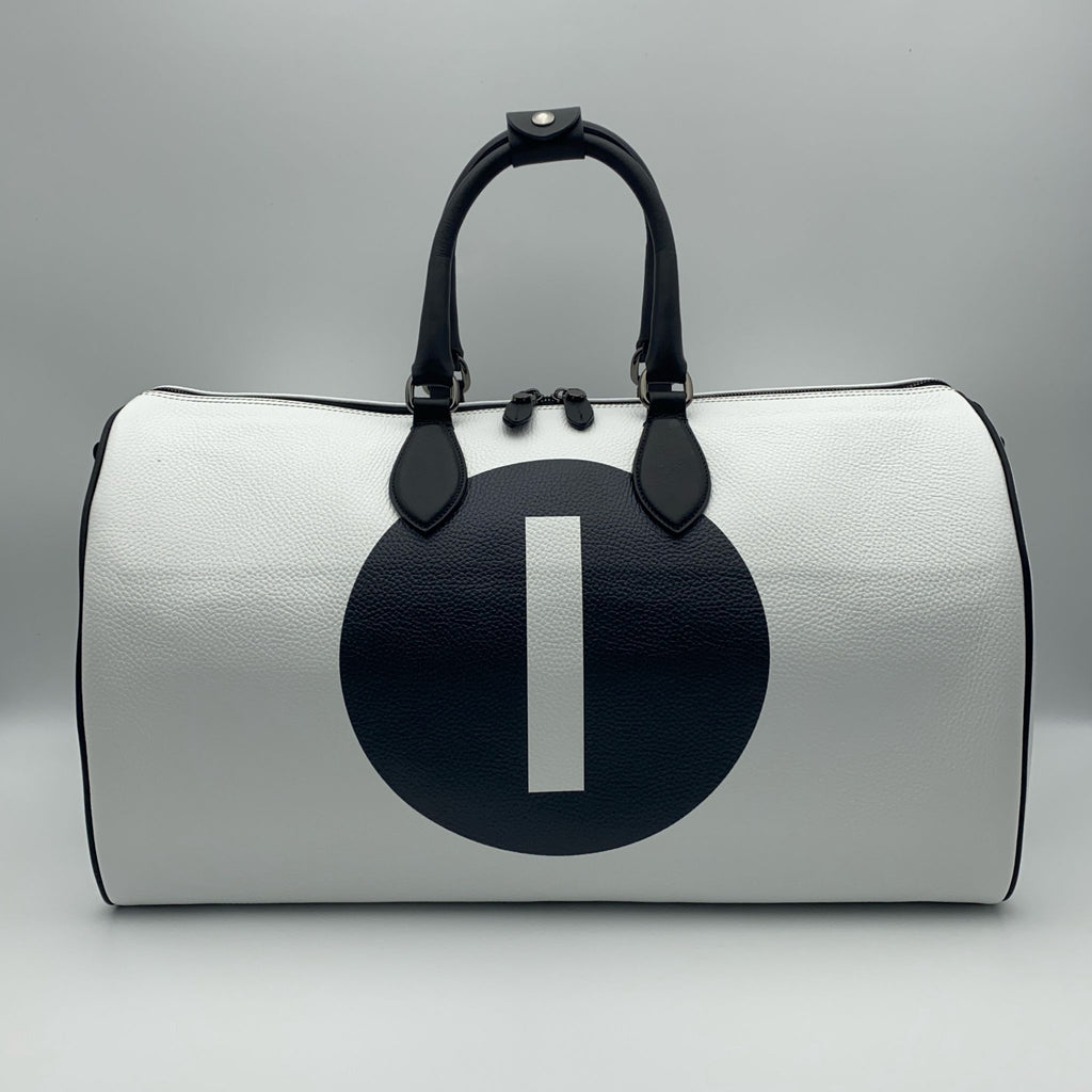 White leather duffle bag with a black circle and white number '1' on a white background