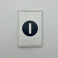 White passport cover with a white number "1" in black circle on a white background