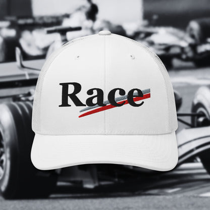 White cap with 'Race' text in front of a blurred racing background